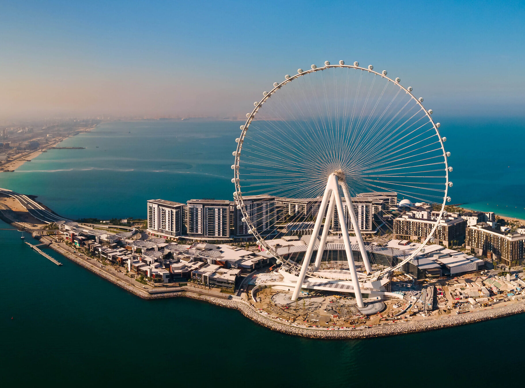 Bluewaters island and Ain Dubai ferris wheel on in Dubai, United Arab Emirates aerial view. New leisure and residential area in Dubai marina area